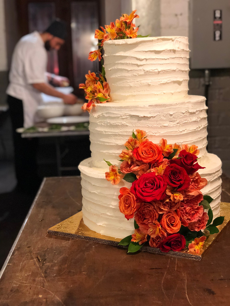 Wedding cake with fresh flowers